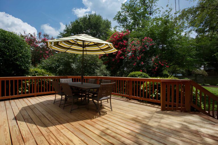 Wooden outdoor deck with dining set